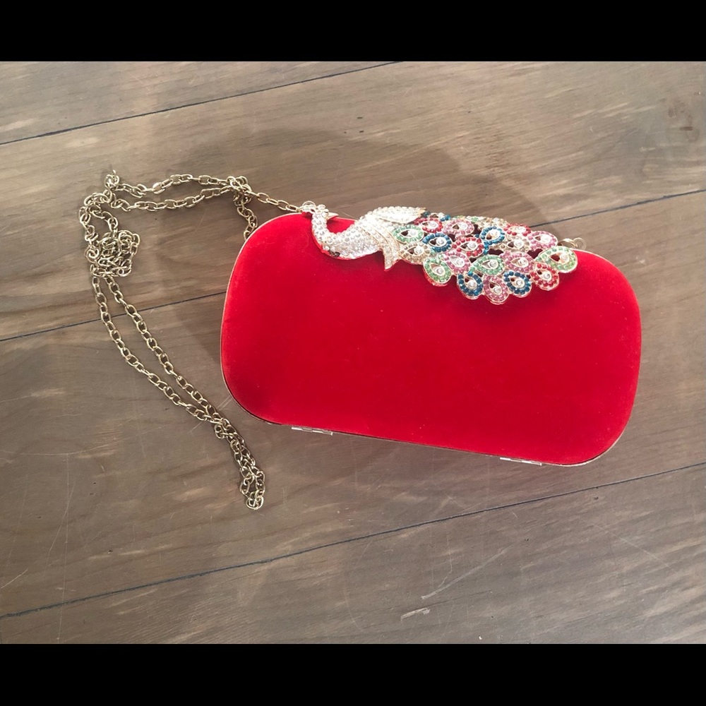 Red clutch purse with peacock clasp